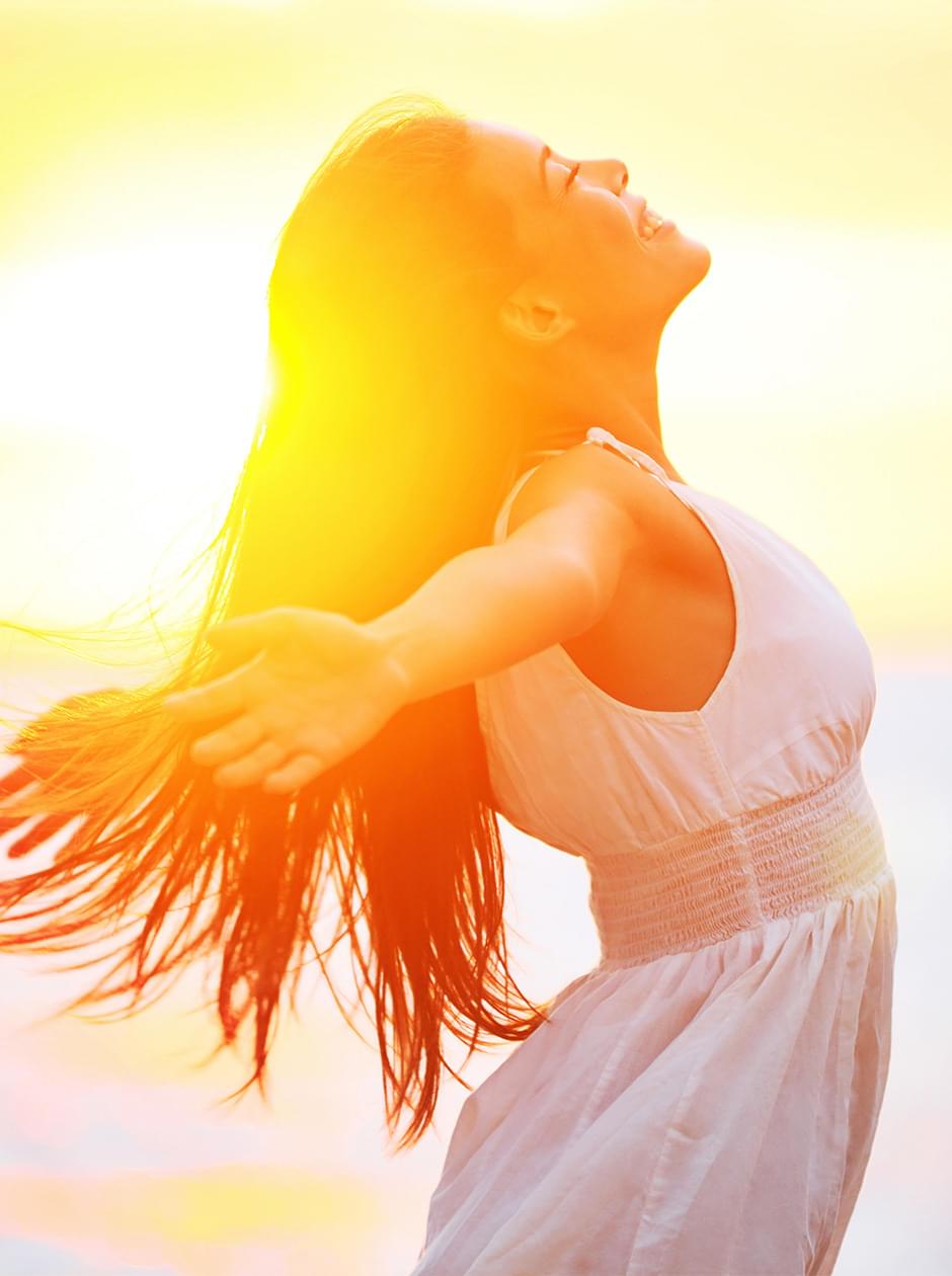 Photo of young woman enjoying sunshine